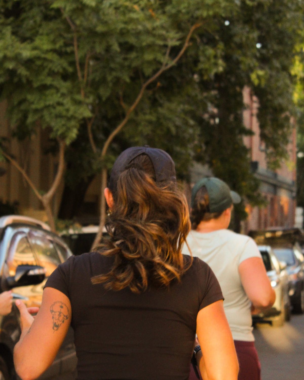 C series core running cap worn with a ponytail on a city run