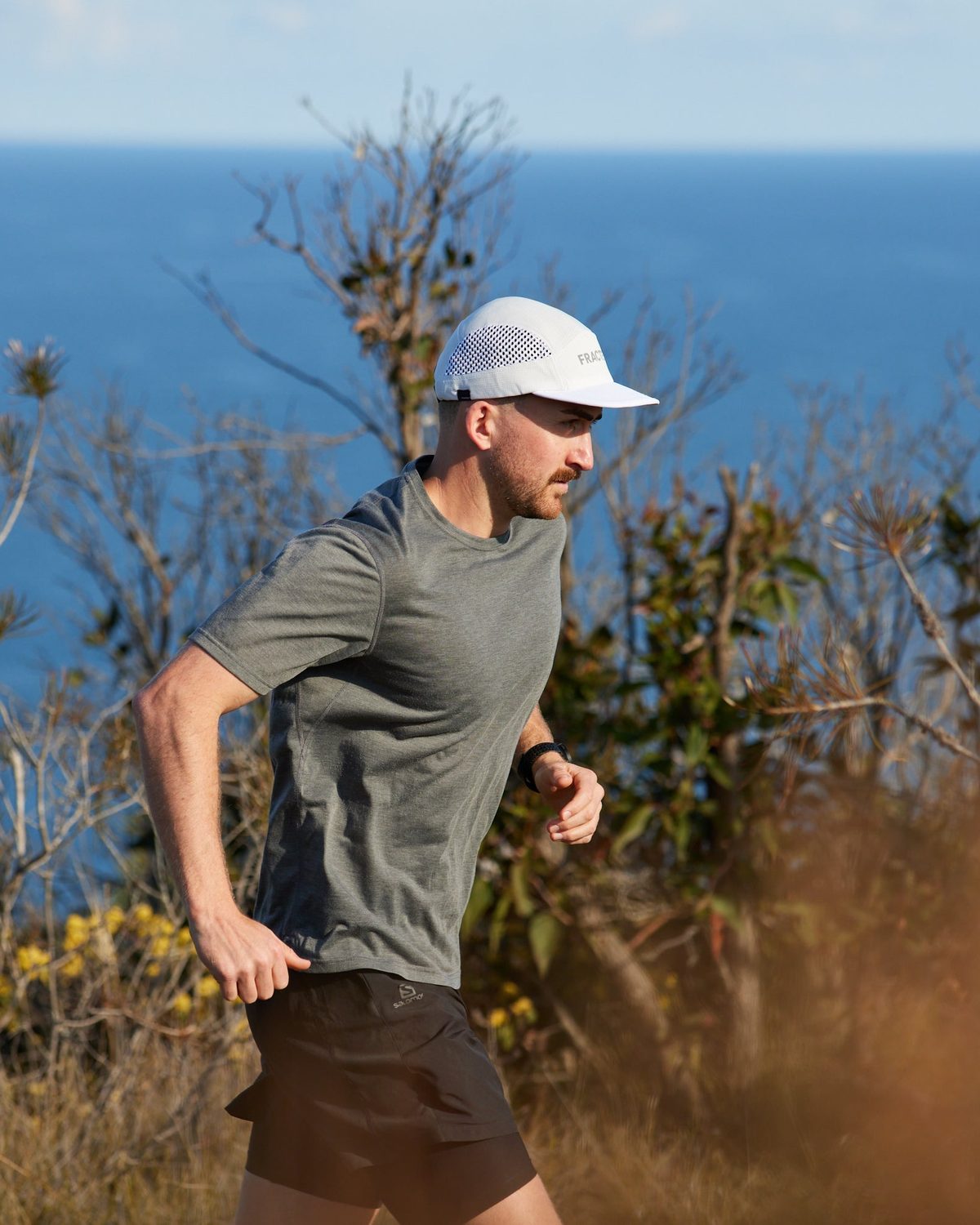 M series core running cap in white worn on a headland run