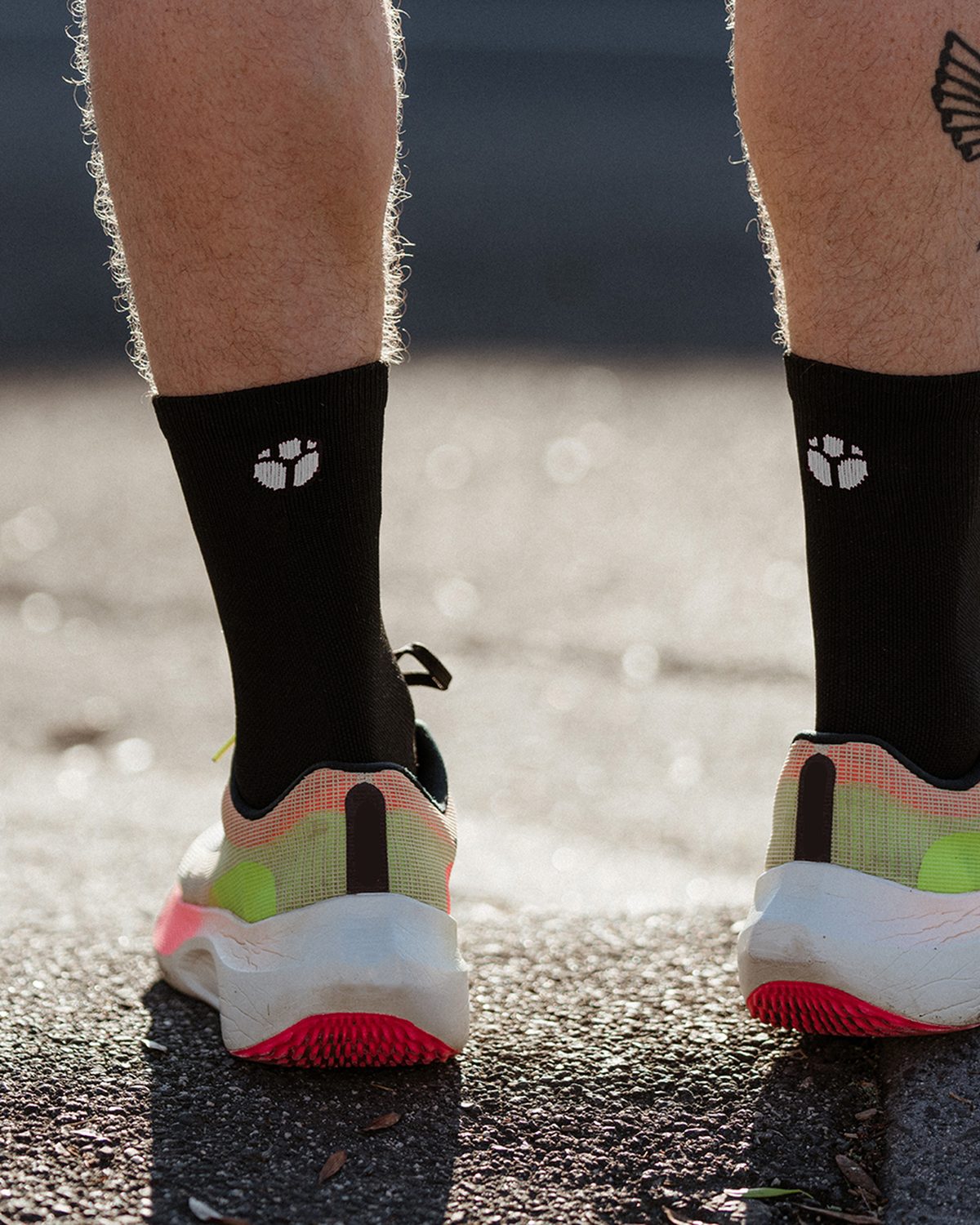 Fractel quarter running socks range: black socks with a white logo