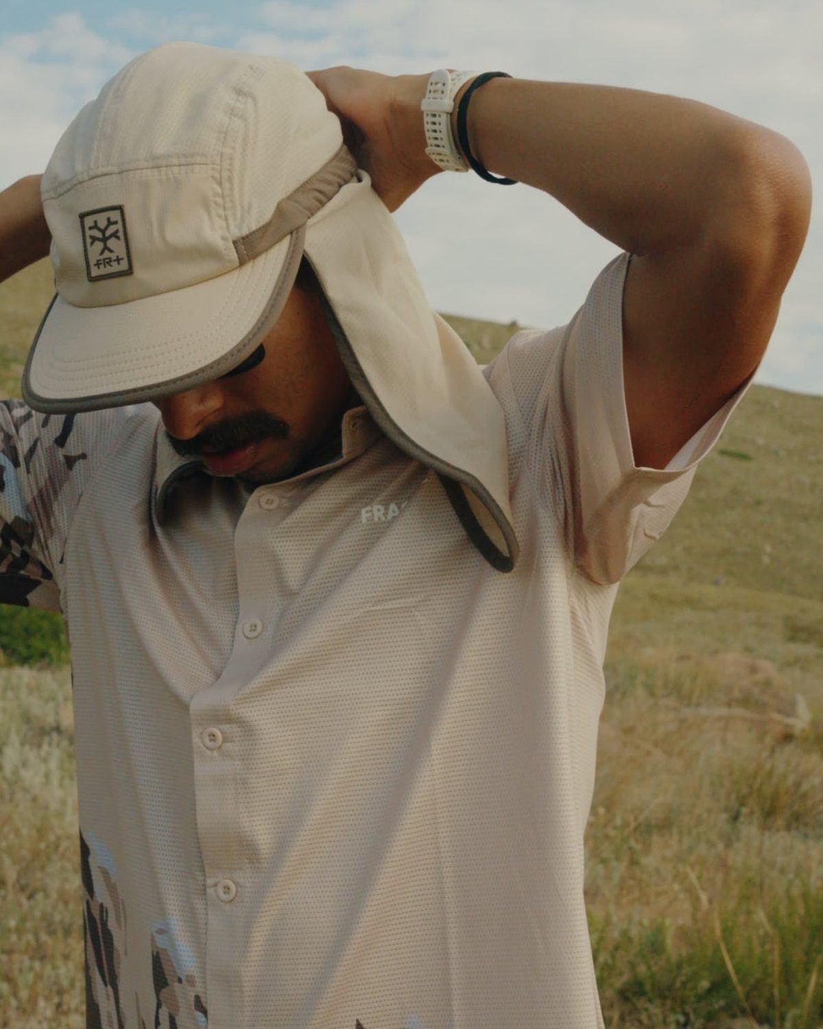 Limited edition running shirt from the Rockies collection worn with a neck cape hat