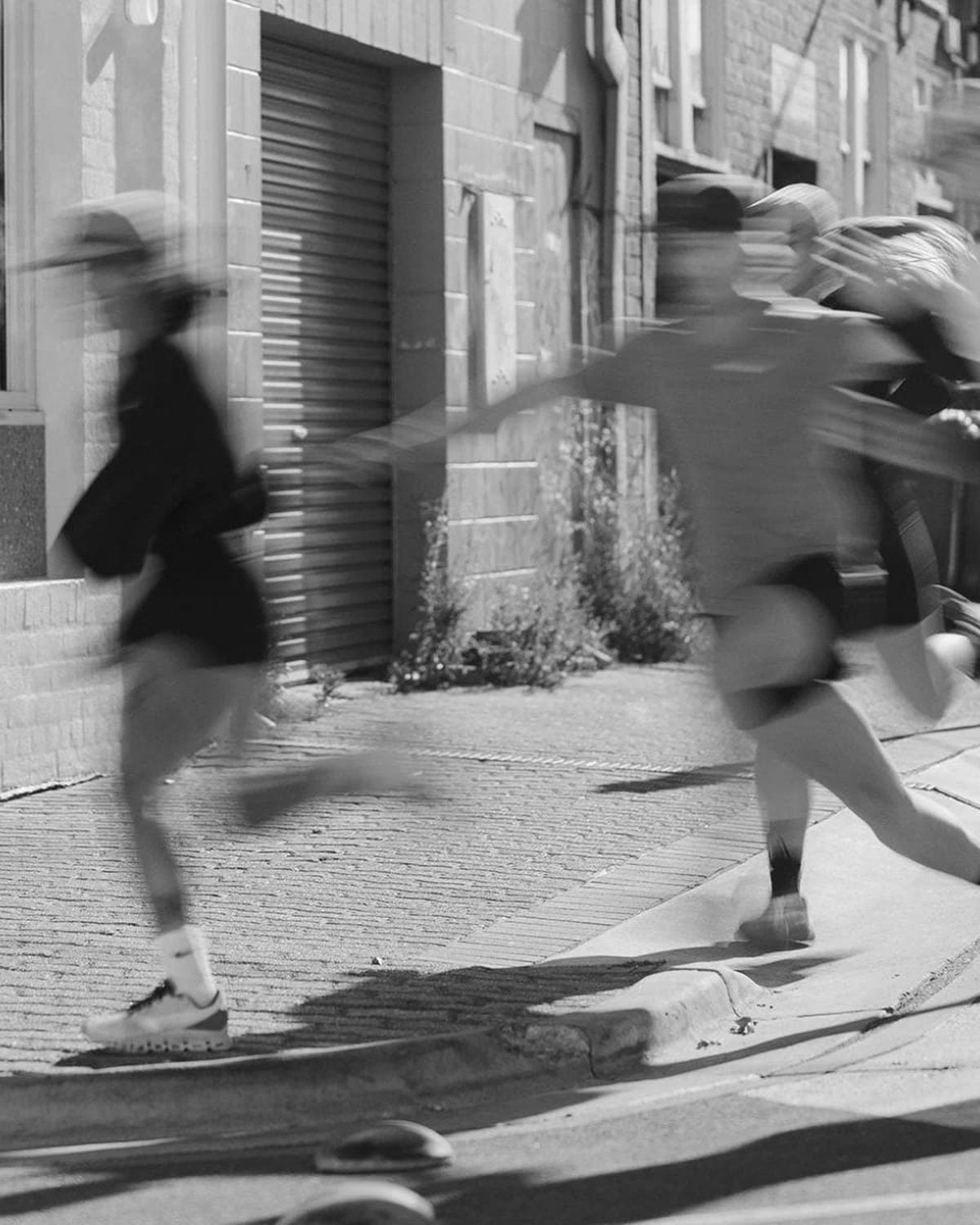 Fractel sale: discounted running gear worn by runners in motion in black and white